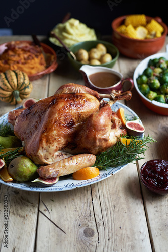 Turkey dinner and side dishes on a wood background. photo