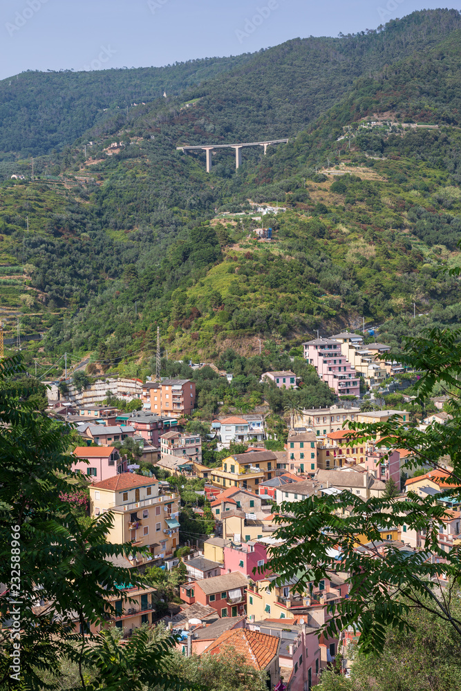 Looking back to the town of Monterosso al Mare and the freeway bridge high above the town, Liguria, Italy