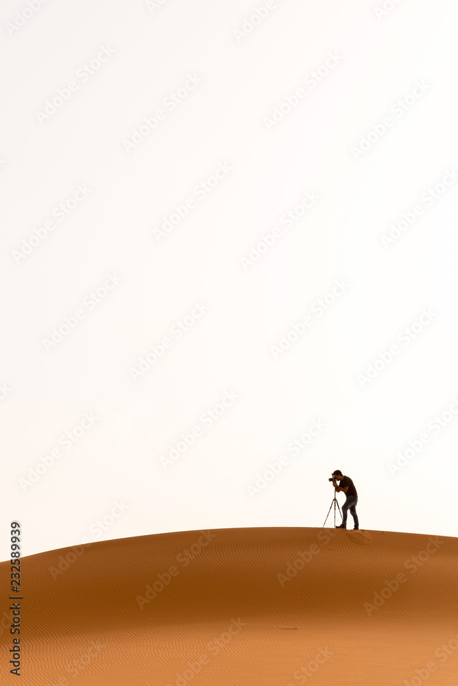 Shooting sand dunes with a camera on a tripod Shooting sand dunes with a camera on a tripod