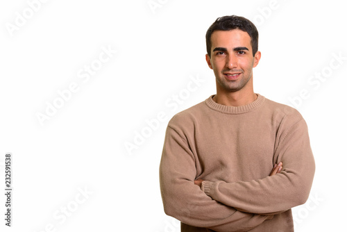 Portrait of young confident Persian man against white background © Ranta Images