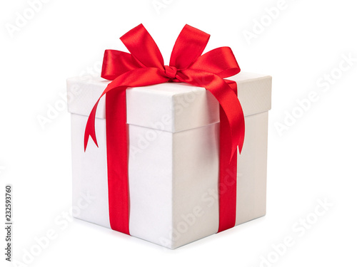 White gift box with red ribbon bow, isolated on white photo