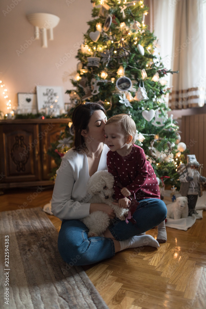 Mother and child by the christmas tree Mother and child by the christmas tree