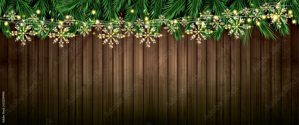 Fir Branch with Neon Lights and Golden Garland with Snowflakes on Wooden Background. Fir Branch with Neon Lights and Golden Garland with Snowflakes on Wooden Background.