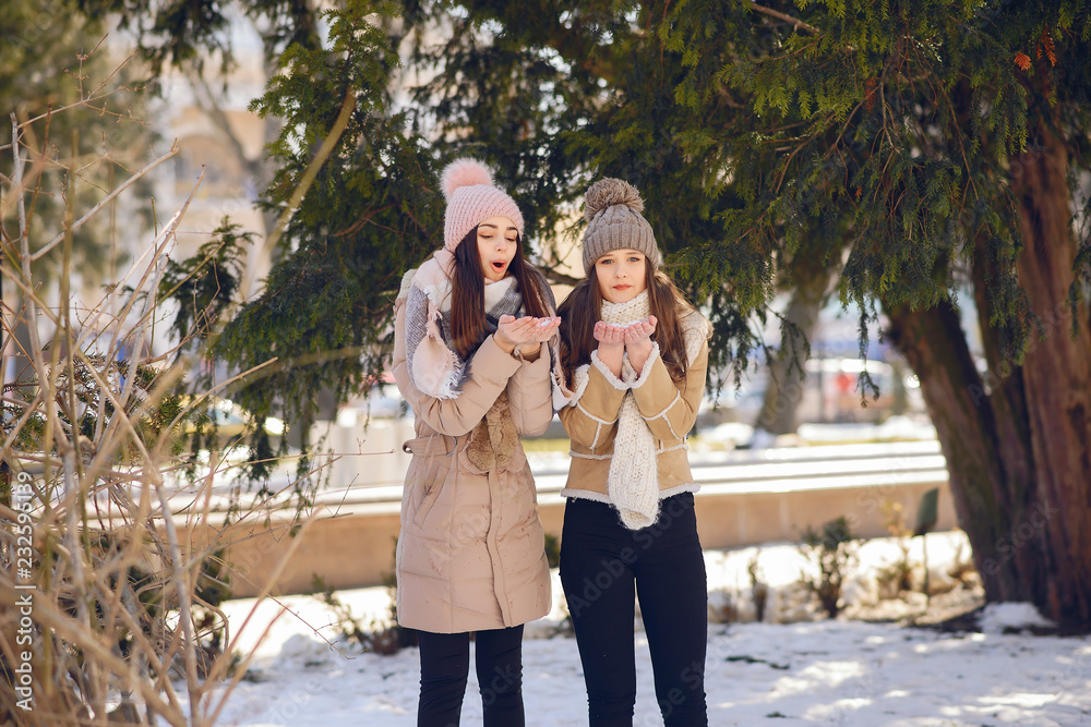 Happy girls in a winter city