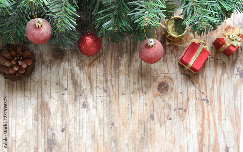 christmas tree background with decorations on wooden board