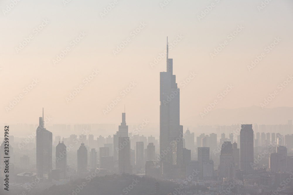 Nanjing, China. Severe air pollution, haze and poor visibility make the tall buildings in the city hard to see clearly