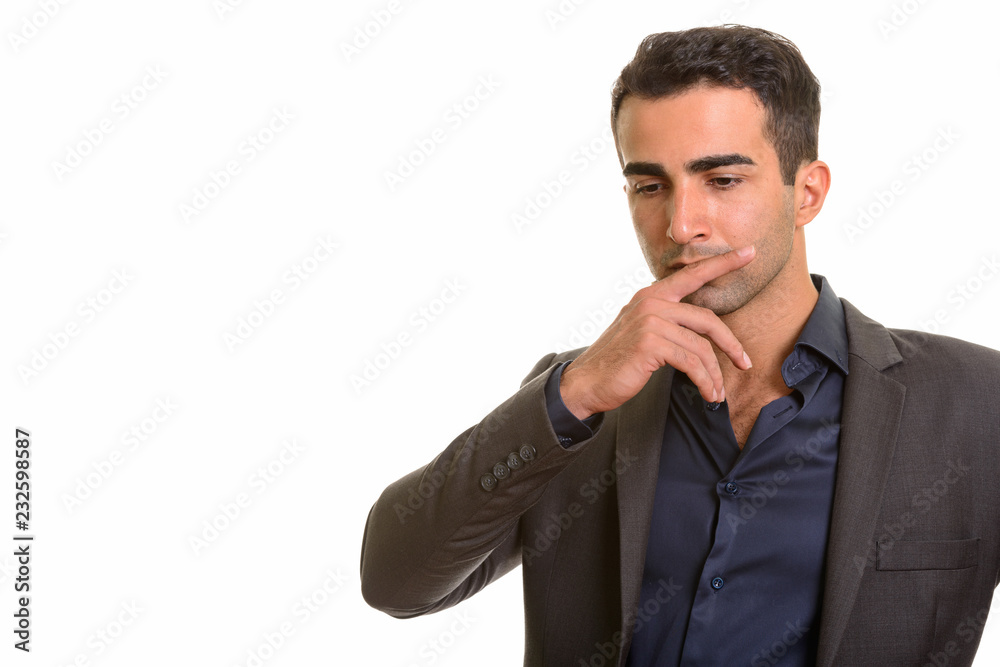 Portrait of young handsome Persian businessman against white background Portrait of young handsome Persian businessman against white background