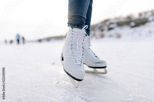 Crop woman skating on rink