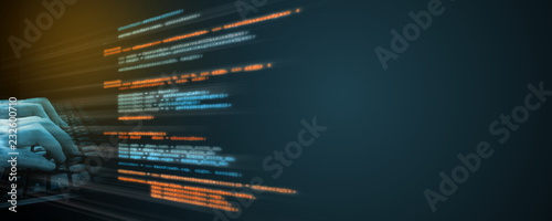 Software source coding. Programmer using finger typing on keyboard with overlay text. Concept for software development life cycle (SDLC), Capability Maturity Model Integration (CMMI), Agile,  Scrum