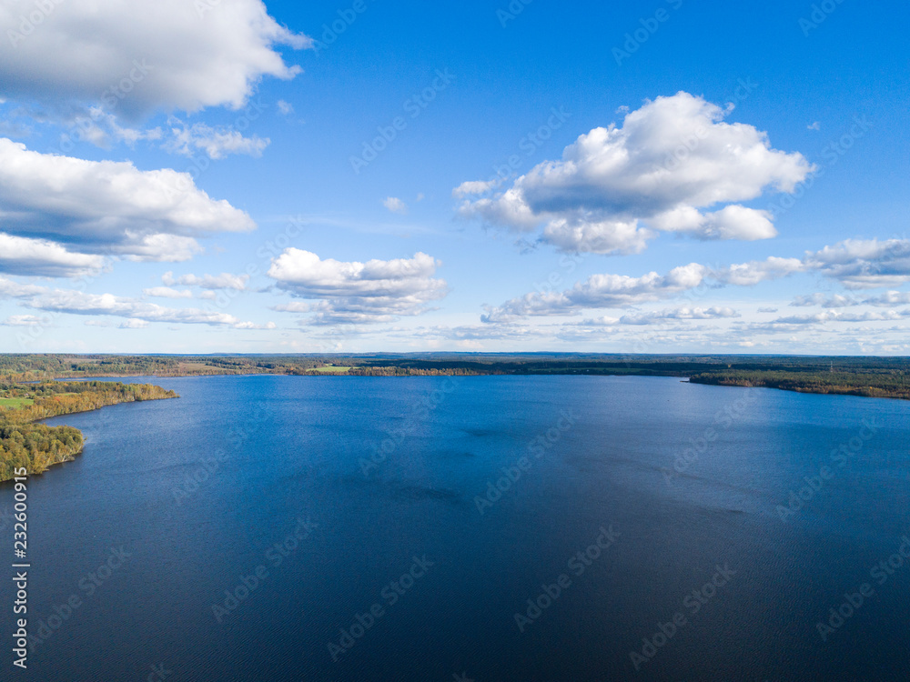 Aerial view of seashore with beach, lagoons. Coastline with sand and water. Landscape. Aerial photography. Birdseye. Sky, clouds. Stunning sky clouds. Sky landscape.
