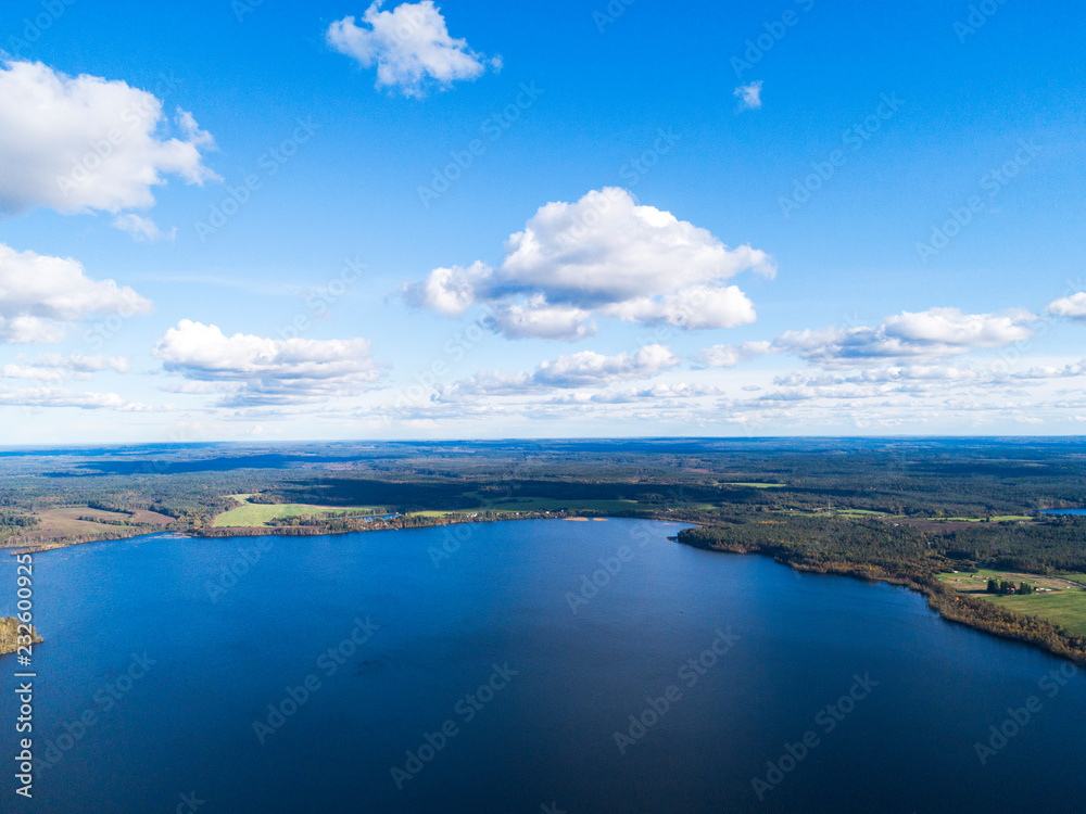 Aerial view of seashore with beach, lagoons. Coastline with sand and water. Landscape. Aerial photography. Birdseye. Sky, clouds. Stunning sky clouds. Sky landscape.