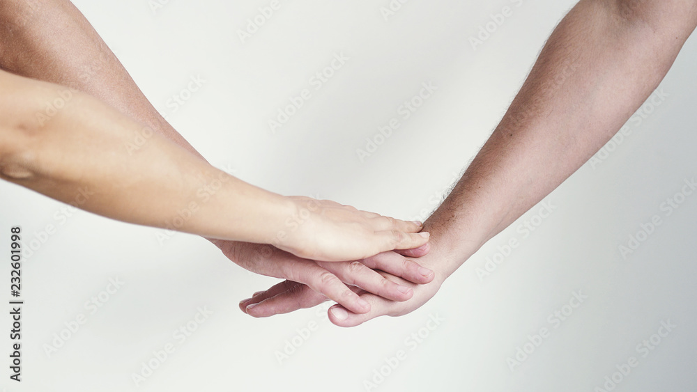 Three hands getting together on a white background. Three hands getting together on a white background.