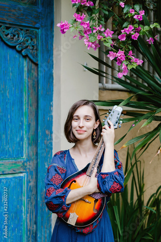 Young girl holding a ukulele photo