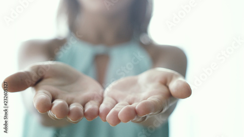 Inviting invitation Gesture by young woman opening palms