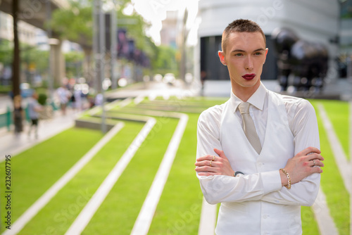 Young androgynous homosexual LGTB businessman wearing lipstick