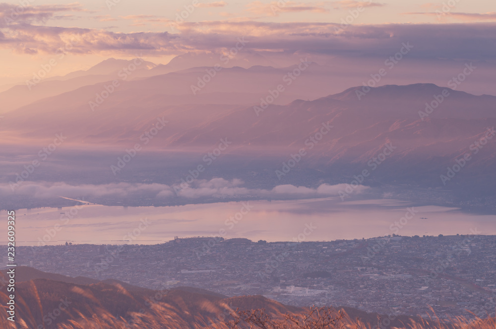 Fototapeta premium Dawning with lake suwa at yatsugatake