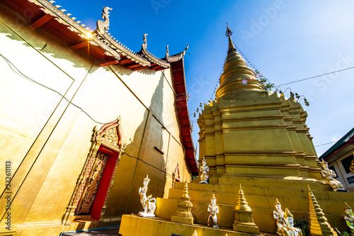 Thai style church with ancient pagoda in Pa Sang Ngam temple photo