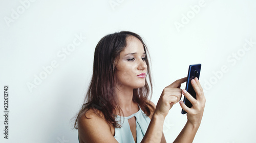 Businesswoman uses mobile phone press by media or social networks. close up.