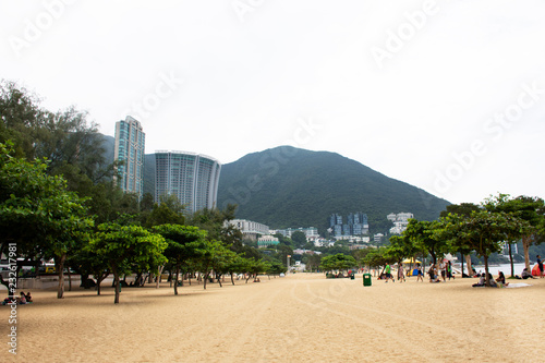 Chinese people and foreigner travelers travel relax on the beach and swimming in the sea at Repulse Bay in Hong Kong, China