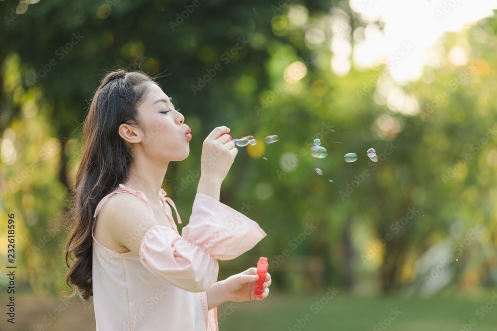 young woman with playing bubble balloons young woman with playing bubble balloons