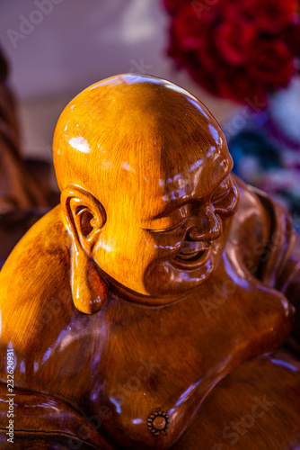 Phra sangkatchai monk statue made from wood in Hyuaplakang temple photo