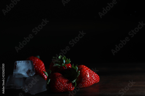 Fresh ripe strawberries on a wooden table