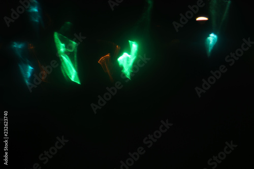lens flare creative abstract background. colorful soft blurred defocused light flashes and beams. festive disco nightlife atmosphere