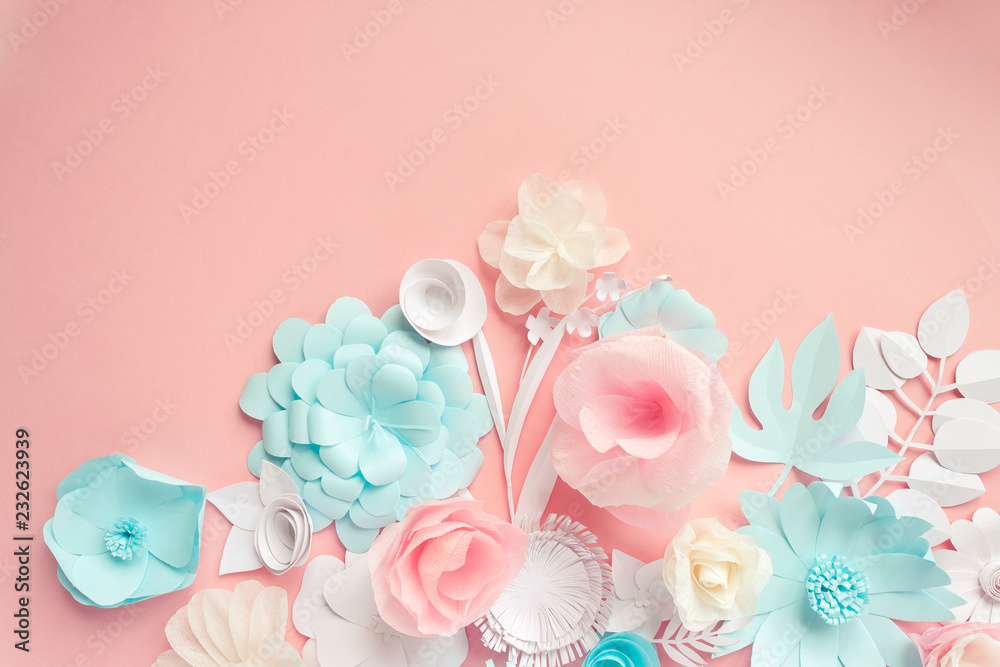 blue, pink and white paper flowers on the pink background
