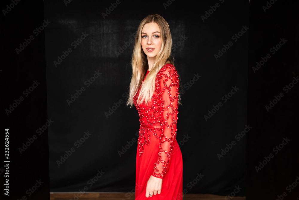 Fototapeta premium beautiful young girl in red dress