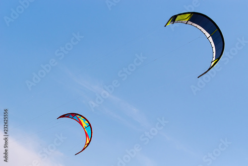 Kiteboarding kites flying in the sky.