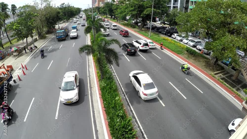 Aerial video of different sort of vehicles passing by two-way highway Aerial video of different sort of vehicles passing by two-way highway