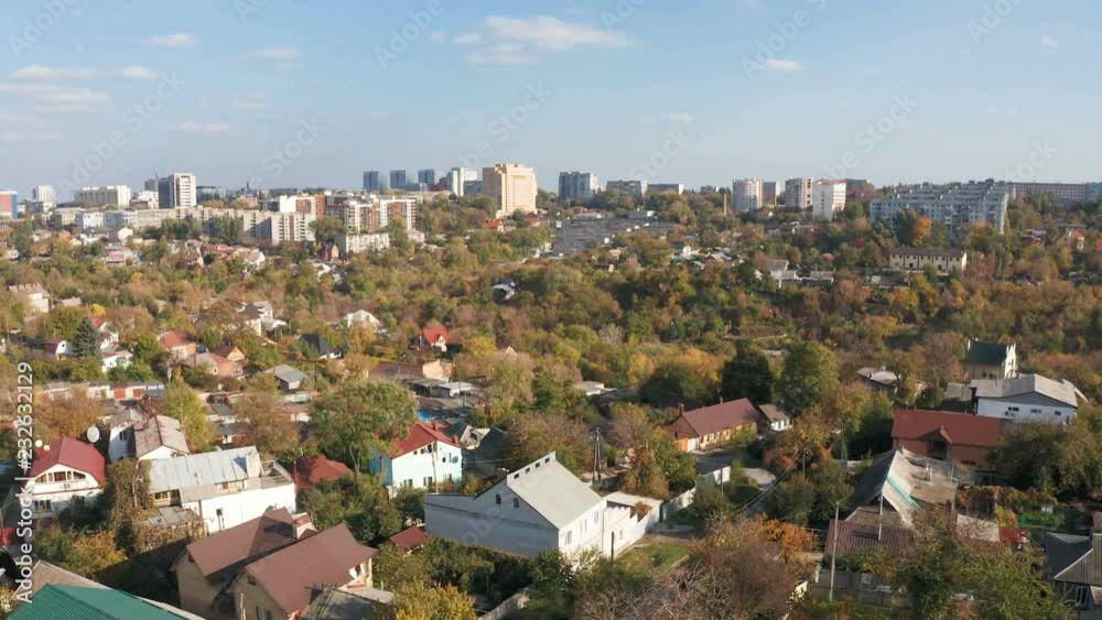 Aerial view of autumn cityscape from the drone. Urban trees against skyline background. Aerial view of autumn cityscape from the drone. Urban trees against skyline background.