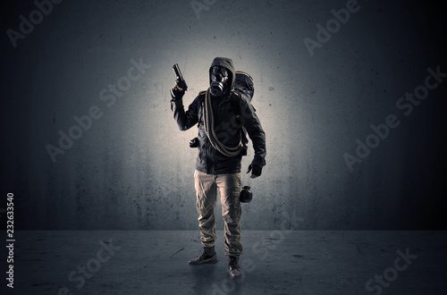 Bad agent in a dark room with arms on his hand and gas mask  © ra2 studio