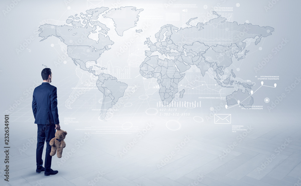 Businessman standing with his back and looking at a worldwide map with objects in his hand
Businessman standing with his back and looking at a worldwide map with objects in his hand