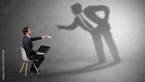 Photography Businessman staying and offering stuffs to a shadow businessman