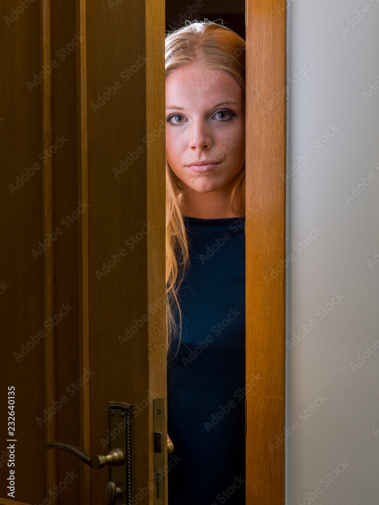 Teenager is surprised to open a door. Teenager is surprised to open a door.