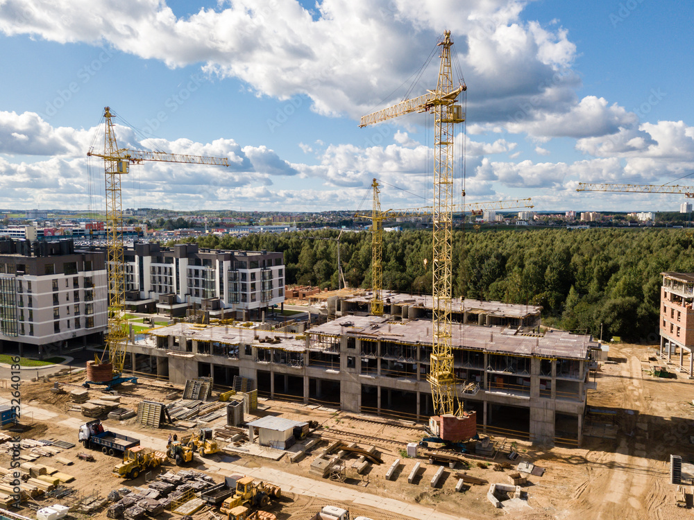 Construction site with crane and building. Aerial drone view