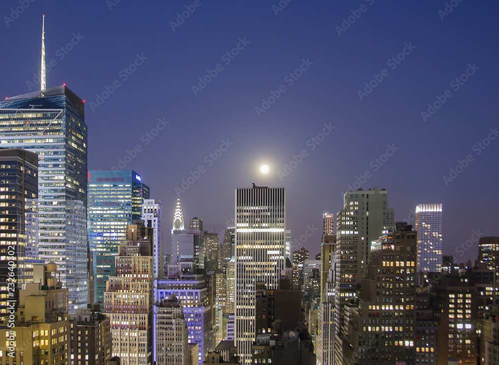 New York buildings at night illuminated by moonlight