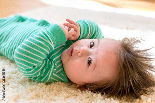 Little baby boy lying down and resting