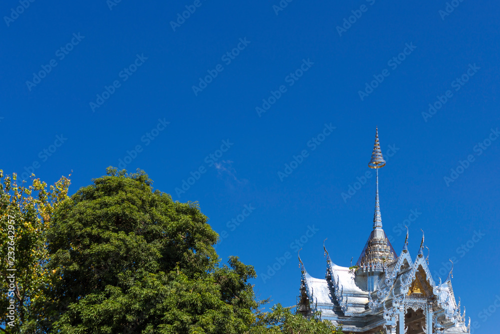 The top of Thai temple and tree. Imagine the paradise.