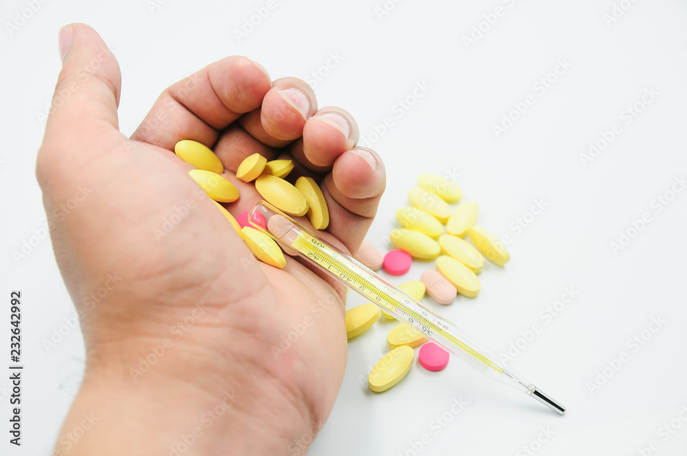 Colorful pills and medicines in the hand