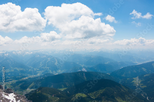 On peak of Dachstein and view alpine mountains