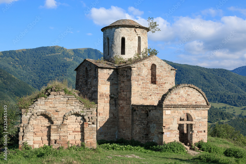 Old church in mountains, in national park Dombai, Caucasus, Russia