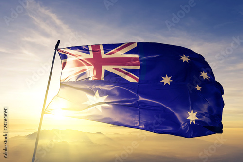 Obraz na plátne Australia Australian flag textile cloth fabric waving on the top sunrise mist fo