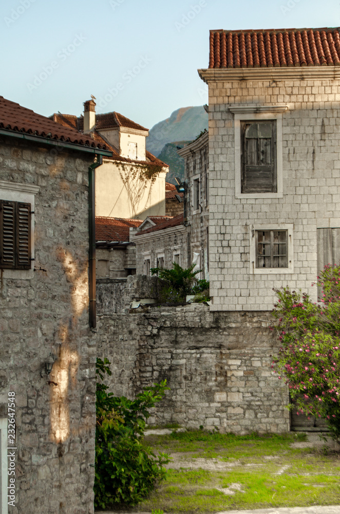 Buildings of the old town with a red tiled roof.