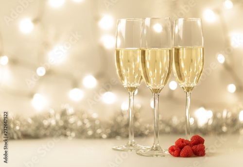 Christmas background with champagne and lights © degrafie43