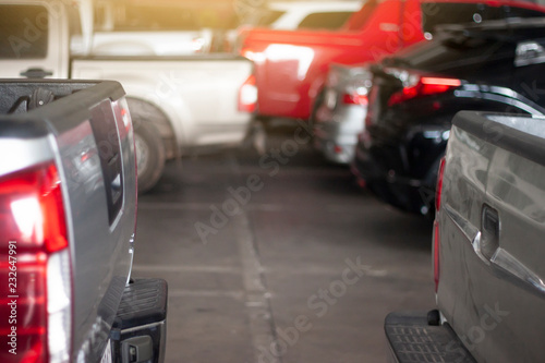 Cars parked behind the collision in the parking lot.