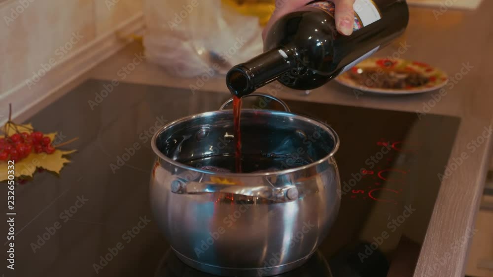 Cooking mulled wine. Bottle of wine. Cooking mulled wine. Bottle of wine.