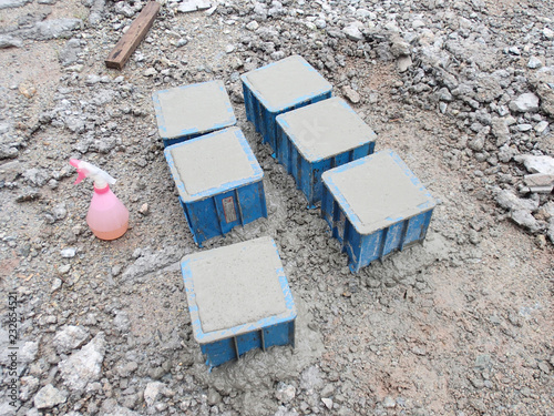 Cube test. Steel mold in square shape used to get standard square shape concrete block. The concrete block will be used for compression test in laboratory.  photo