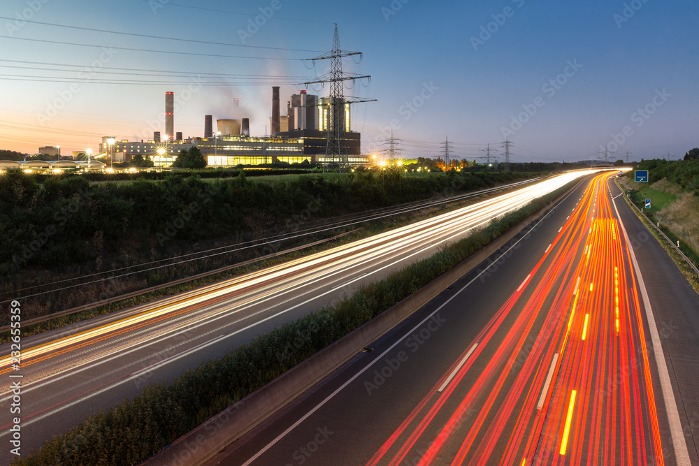 Long exposure sunset over German highway along power plant , Germany Long exposure sunset over German highway along power plant , Germany